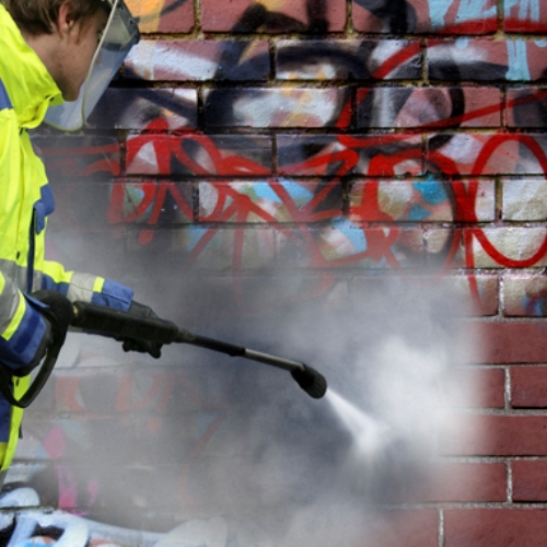 Graffiti Removal Contractor Cleaning Graffiti from Brick